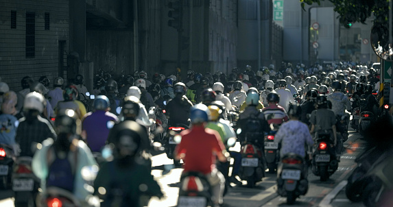 Taiwan's crowded motorcycle commuters wear masks and drive on the road during the epidemic prevention period