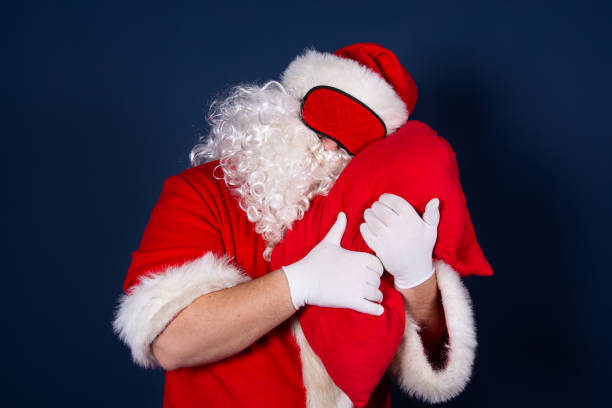 istock Rest. Funny Santa Claus, sleep and pillows. 1337092566