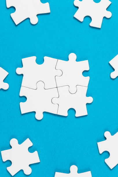 istock Four Puzzle Pieces Connected on Blue Background 1337096919