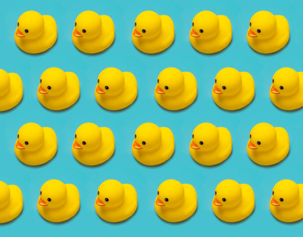 istock yellow rubber toy duck isolated on blue background 1337098617