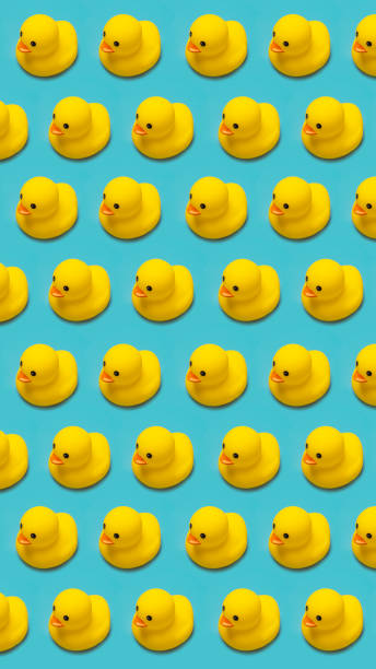 istock yellow rubber toy duck isolated on blue background 1337098619
