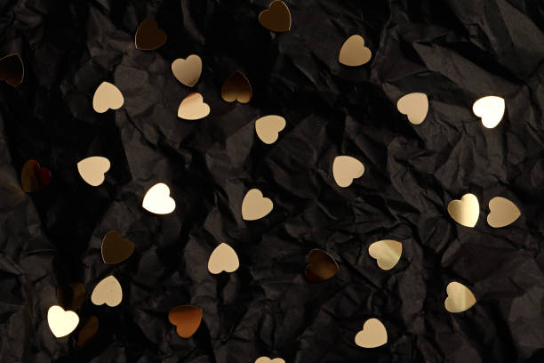 istock Abstract black background with golden hearts.Valentines day concept. 1337099850