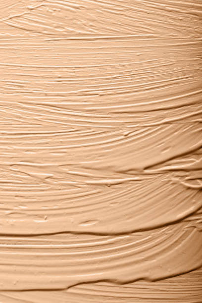 istock Textured background from foundation.Closeup cosmetics smear.Beige abstract backdrop.Cosmetics concept. 1337099856