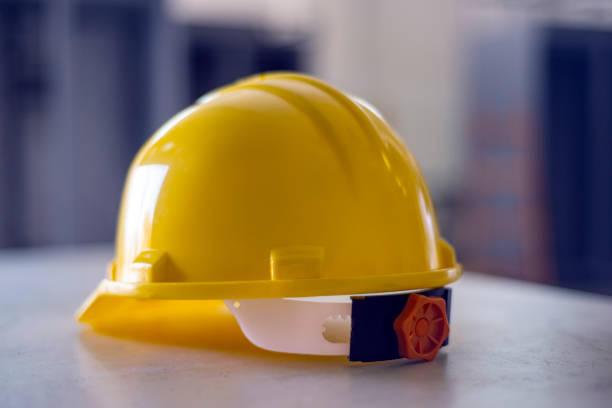 istock A yellow safety helmet placed on a desk 1337100674