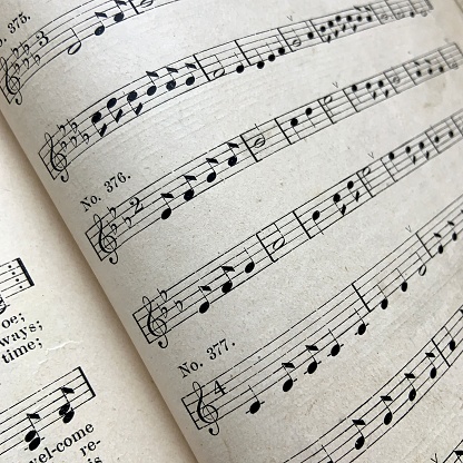 Close up 19th century music book for voice