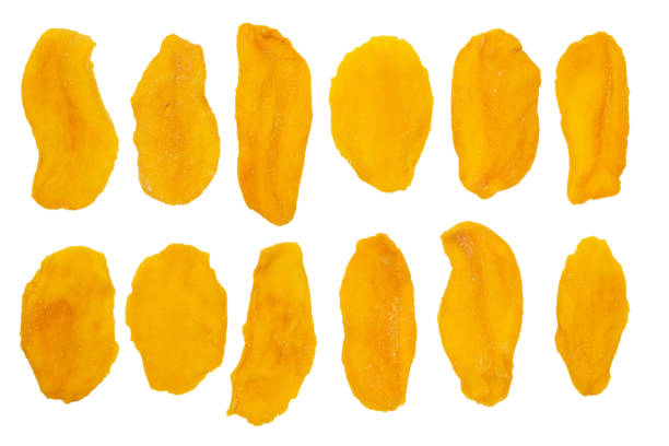 Dry tasty mango slices isolated on a white background. Top view.