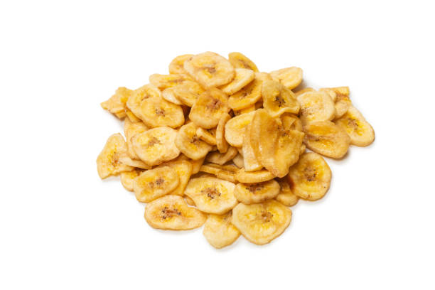 istock Banana chips isolated on a white background. Dehydrated banana. 1337102856