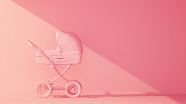 pink baby stroller side view on pink background stock photo