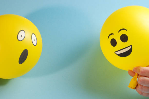 istock Yellow emoji balloons on a blue background. 1337103511
