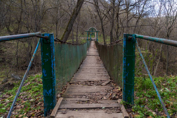 istock Suspension old bridge for tourists. Selective focus 1337109191