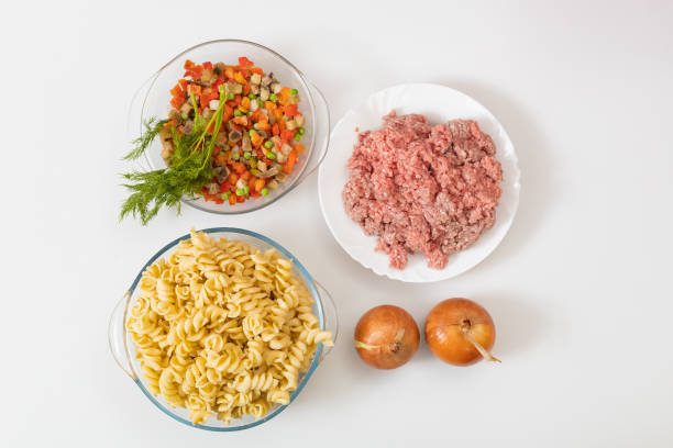 Pasta with minced meat. A traditional naval dish. Background. Raw ingredients