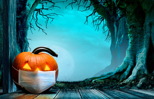 istock Jack O'Lantern Sits On Porch In Front Of Spooky Trees 1337109723