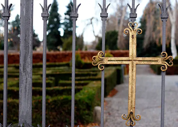 Cross on iron gate into churchyard