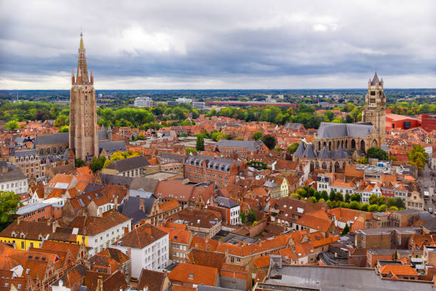Bruges, Flanders, Belgium, Europe - October 1, 2019. Autumn scenery of medieval world heritage city, Bruges (Brugge) from the Belfry tower. Aerial view of Church of Our Lady (Vrouwekerk) and St. Salvator's Cathedral brujas, flandes, bélgica, europa - 1 de octubre de 2019. paisaje otoñal de la ciudad medieval patrimonio de la humanidad, brujas (brujas) desde la torre del campanario. vista aérea de la iglesia de nuestra señora (vrouwekerk) y la catedral de san salva