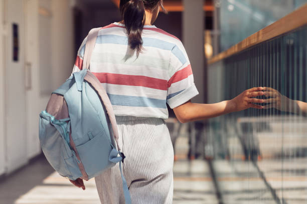 istock Girl Walking to School in Sunlight 1337113055