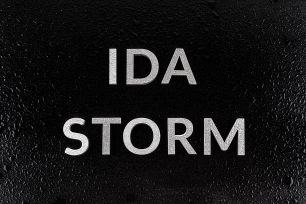istock the words ida storm laid with silver metal letters over black surface both covered with rain water drops 1337115291