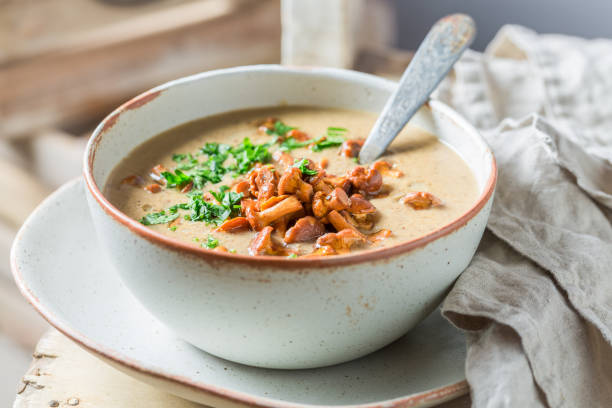 Tasty boletus cream with noble mushrooms. Creamy Boletus soup. Tasty boletus cream with noble mushrooms. Creamy Boletus soup. Noble mushroom soup. chanterelle edible mushroom gourmet uncultivated stock pictures, royalty-free photos & images