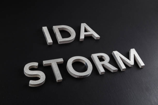istock words ida storm laid with silver metal letters over dry black matte surface 1337115743