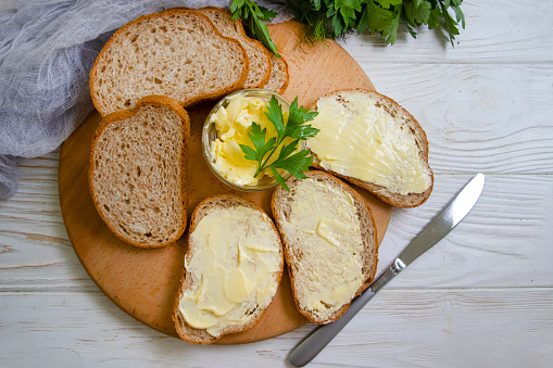 bread, butter on wooden background