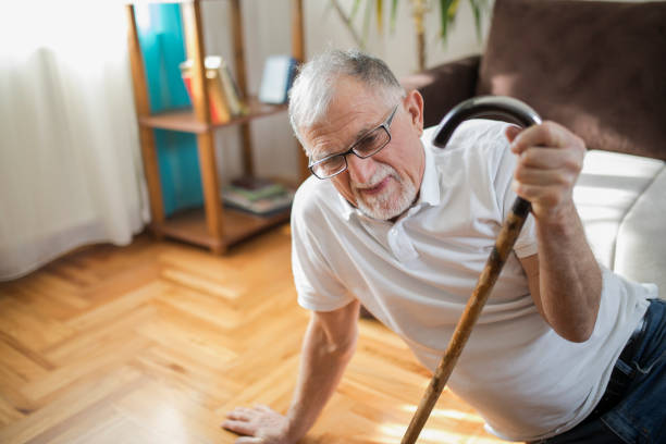 istock Senior man falling down on parquet floor at home 1337118461