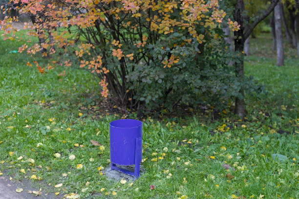 A classic common trash can in an urban environment or city parks. Selective focus background