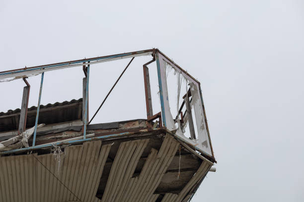istock The aftermath of a severe hurricane that damaged rooftops and destroyed advertising banners. 1337118520