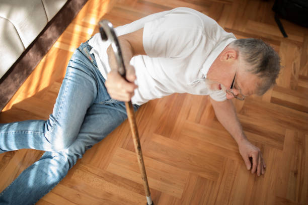 istock Old men with cane falled down on floor 1337118661