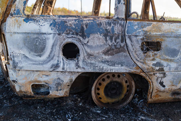 istock Burned down car, abstract background, selective focus. The situation of protests in the world. 1337118844
