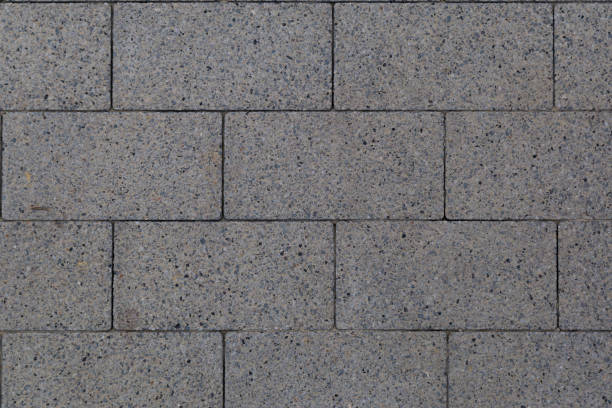 istock Rough textured surface of paving slabs in an urban environment. Background 1337118864