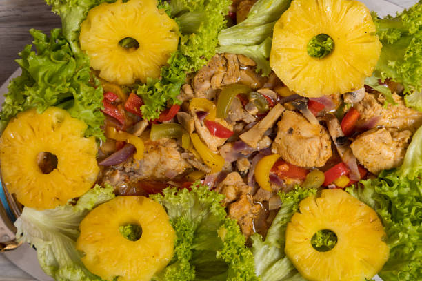 istock Pineapples with chicken meat in vegetables. Culinary background with selective focus 1337118937