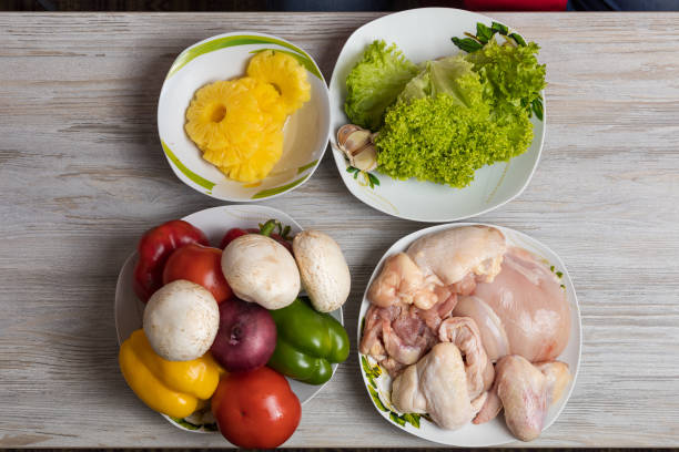 istock Pineapples, vegetables with mushrooms and chicken. Culinary background with selective focus 1337119009