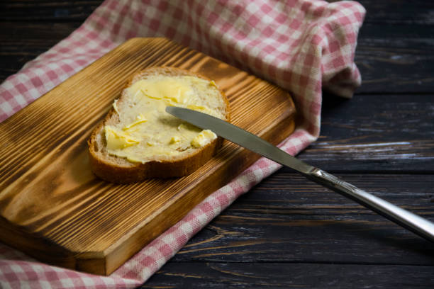 istock bread, butter on wooden background 1337120263