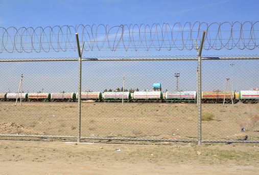 Hairatan,  Kaldar district, Balkh Province, Afghanistan: tank cars used to import oil, fuel and oil derivatives - Hairatan rail freight terminal, terminus of the line, which connects Hairatan to Maulana Jalaluddin Balkhi International Airport in Mazar-i-Sharif -  operated by Uzbekistan's national railway company, Uzbekiston Temir Yullari - connects with Uzbekistan via the Afghanistan-Uzbekistan Friendship Bridge - Hairatan is one of the major transporting, shipping, import and export centers in Afghanistan and the location of the Ghazanfar Oil Refinery.