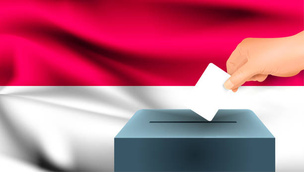 istock Monaco flag, male hand voting with Monaco flag concept idea background 1337134223