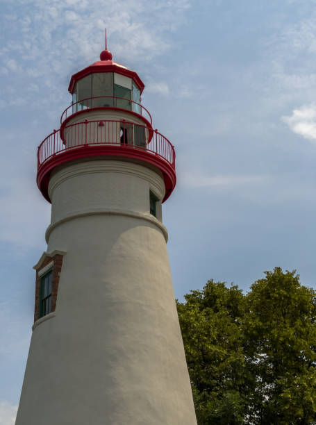 istock Upper section of the Marblehead Lighthouse with cloudy blue sky in background 1337141270
