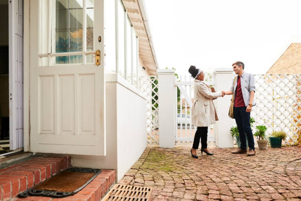 istock Real estate agent shaking hands with a client 1337141323