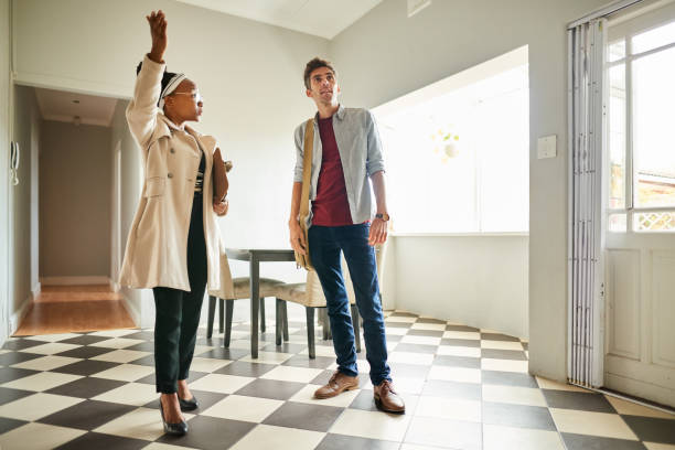 istock Real Estate Agent showing a client around the kitchen a house for sale 1337141349