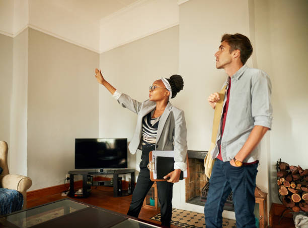istock Real estate agent talking with a client in living room 1337141373
