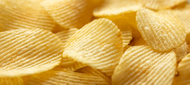 istock crispy golden potato chips snack texture background 1337143528