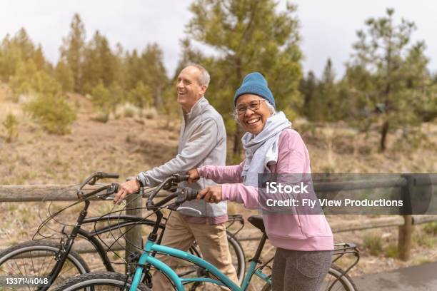 Happy And Healthy Retired Senior Couple Enjoying Vacation Together Stock Photo - Download Image Now