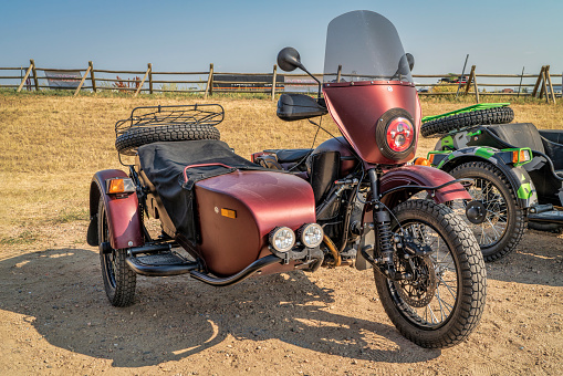 Loveland, CO, USA - August 29, 2021:  Russian made Ural motorcycle with a sidecar adopted for touring and adventure displayed at Overland Expo Mountain West.
