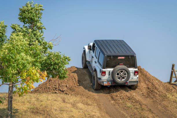 jeep wrangler on a demo drive off-road course - editorial sports utility vehicle car jeep imagens e fotografias de stock