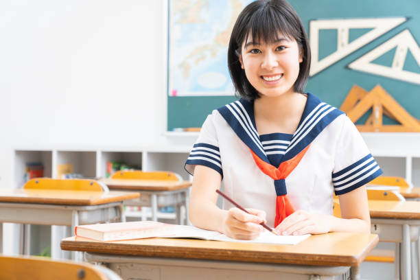 istock Asian schoolgirl studying in the classroom, uniform, 1337154776