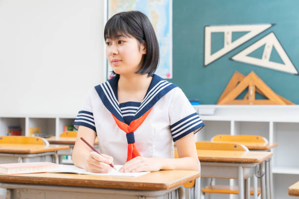 istock Asian schoolgirl studying in the classroom, uniform, 1337154804