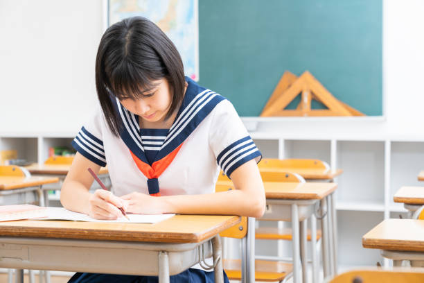 istock Asian schoolgirl studying in the classroom, uniform, 1337154810