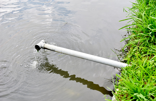 Drain pipe with water flow at the fish pond