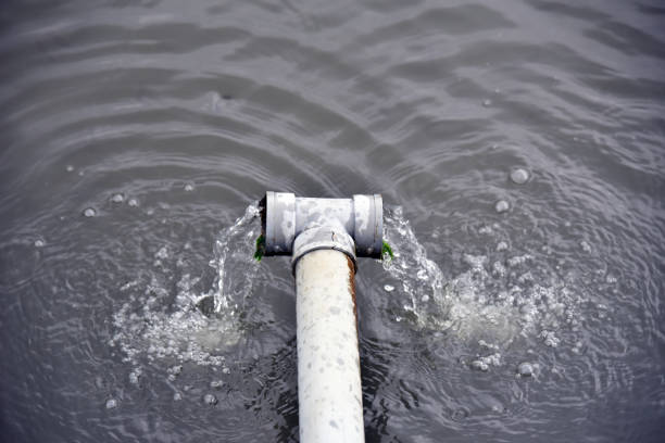 istock Drain pipe with water flow at the fish pond 1337158296
