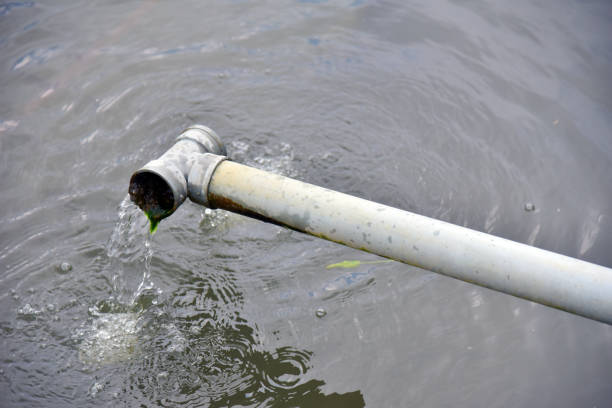 istock Drain pipe with water flow at the fish pond 1337158297