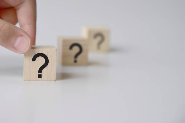 istock Questions Mark word in wooden cube block on table background. FAQ Answer, Q&A. 1337163819