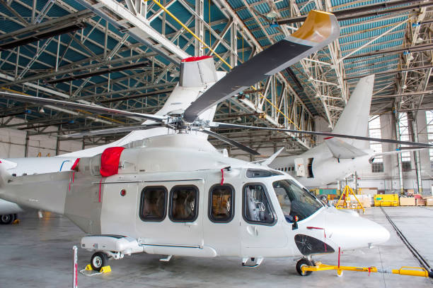 istock Passenger helicopter and airplanes under maintenance. Checking mechanical systems for flight operations 1337169934